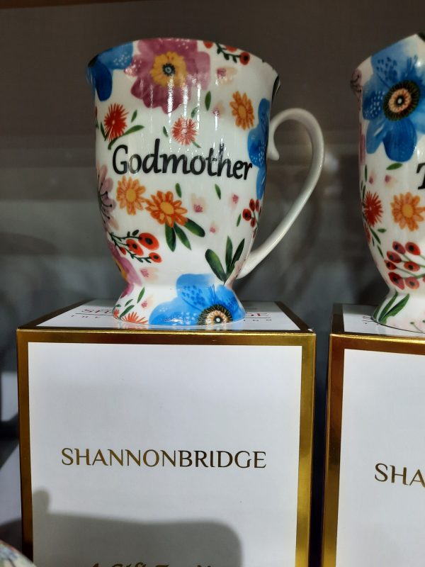 floral mug with godmother written on it