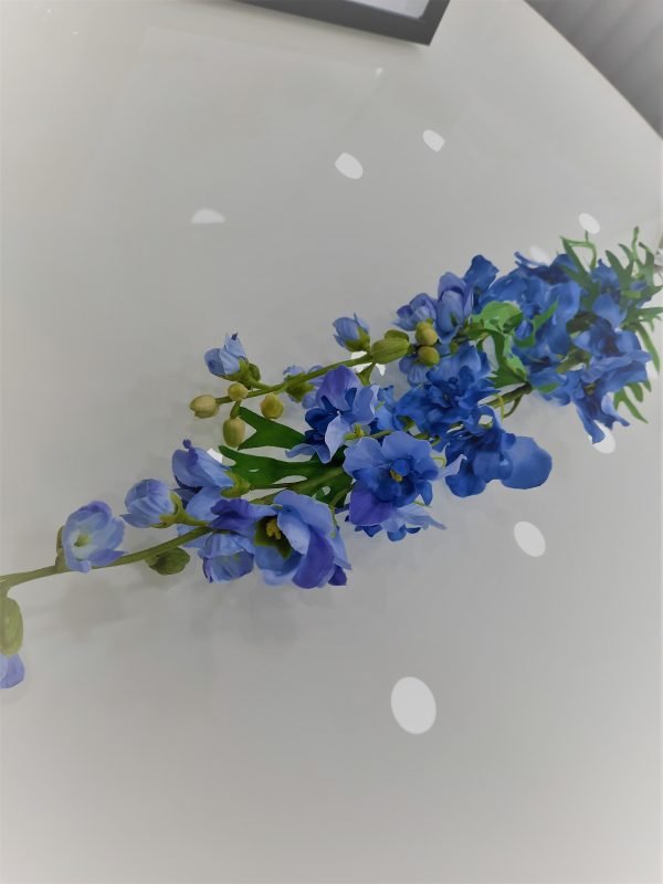 an image of a fake blue delphineum flower