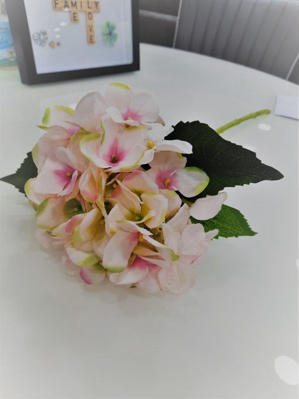 an image of a fake pink hydrangea flower