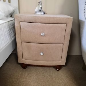 an image of a taupe fabric locker with crystal knobs