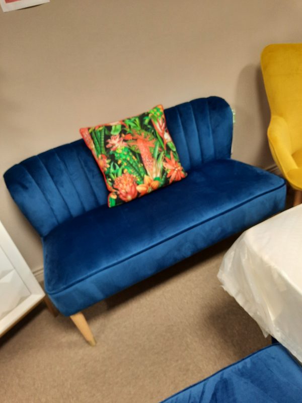 an image of a blue/teal 2 seater settee