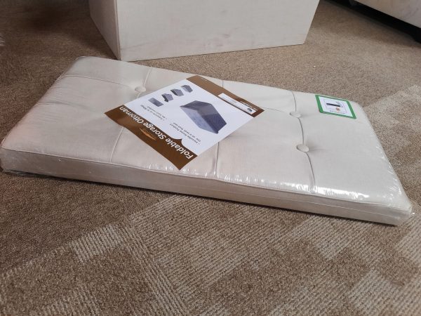 an image of a cream fabric foldable blanket box