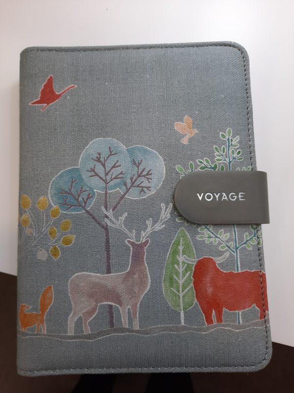 an image of a fabric notebook with animals on it