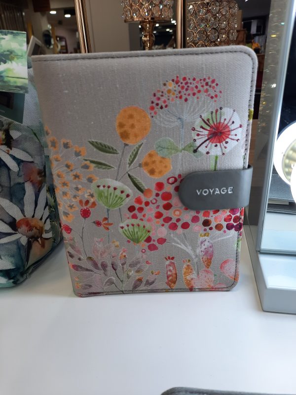 an image of a fabric notebook with a floral design