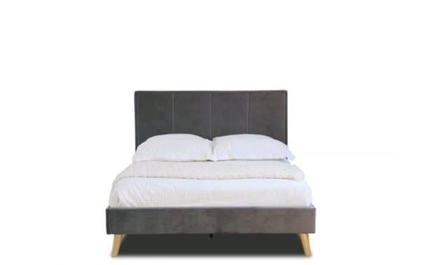an image of a grey velvet bedframe with gold metal feet