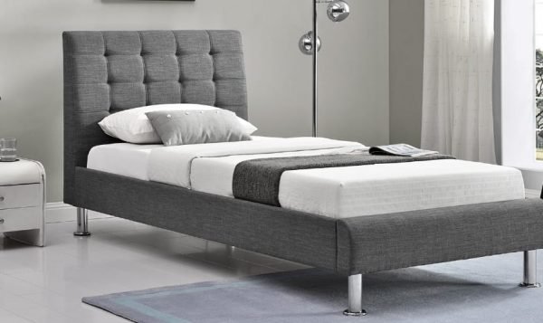 an image of a single grey fabric bed