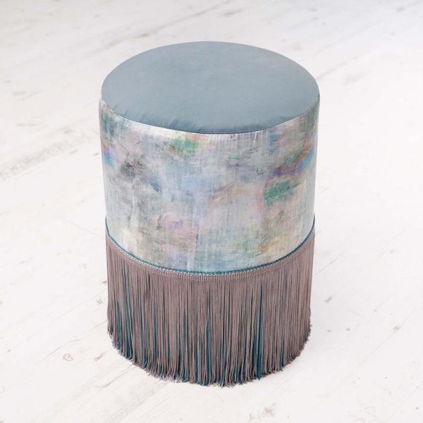 an image of a fringed footstool