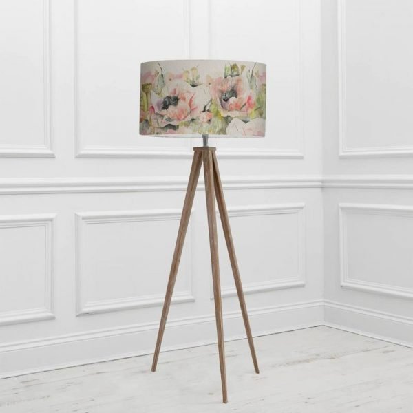 an image of a tripod floor lamp with a floral shade