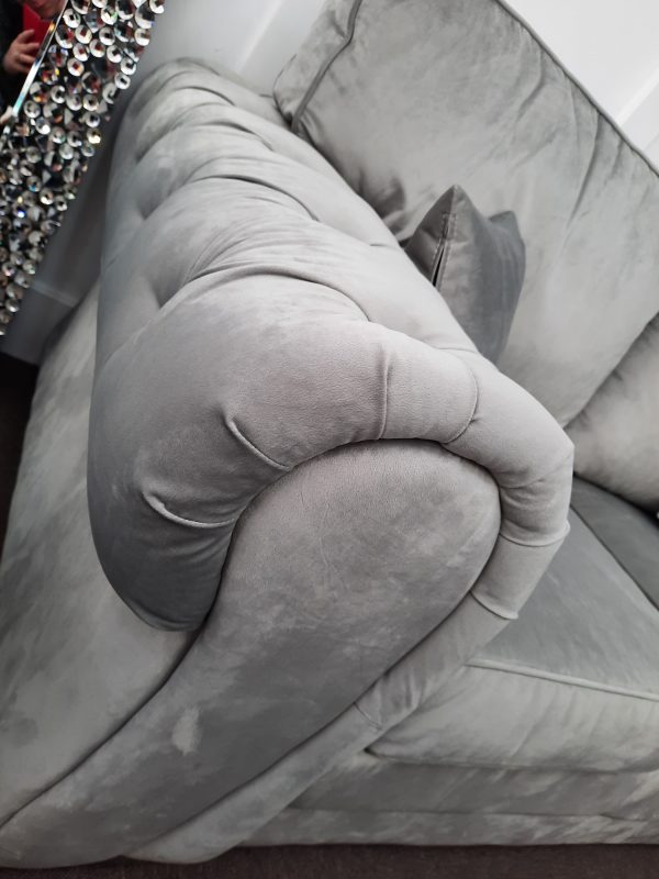 an image of a silver velvet settee arm