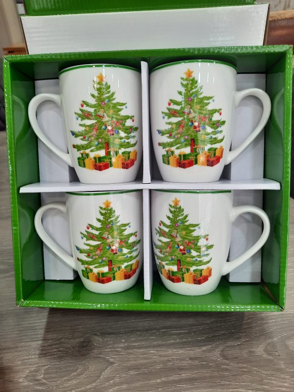 an image of a set of 4 christmas mugs with christmas trees on them in a gift box