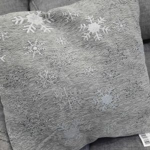 an image of a grey cushion with silver snowflakes
