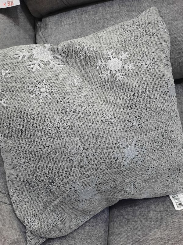 an image of a grey cushion with silver snowflakes